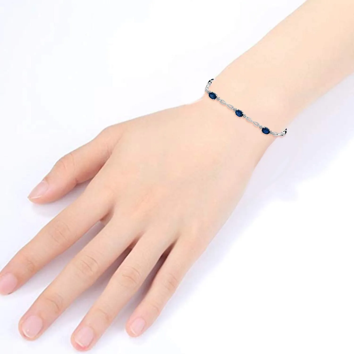 Jewelili Sterling Silver Oval Created Ceylon Sapphire Link Infinity Bracelet, 7.25"
