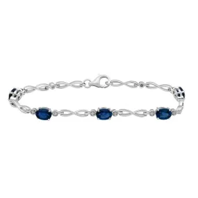 Jewelili Sterling Silver Oval Created Ceylon Sapphire Link Infinity Bracelet, 7.25"